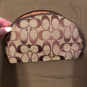 Used coach material makeup bag